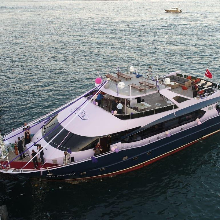 Luxury yacht anchored in a secluded bay near Istanbul, offering a peaceful escape.