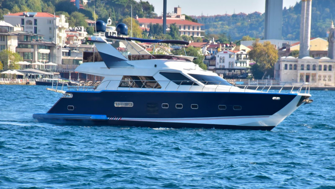Luxury DEN5 yacht cruising on Istanbul's Bosphorus, offering exclusive tours for mid-size groups.