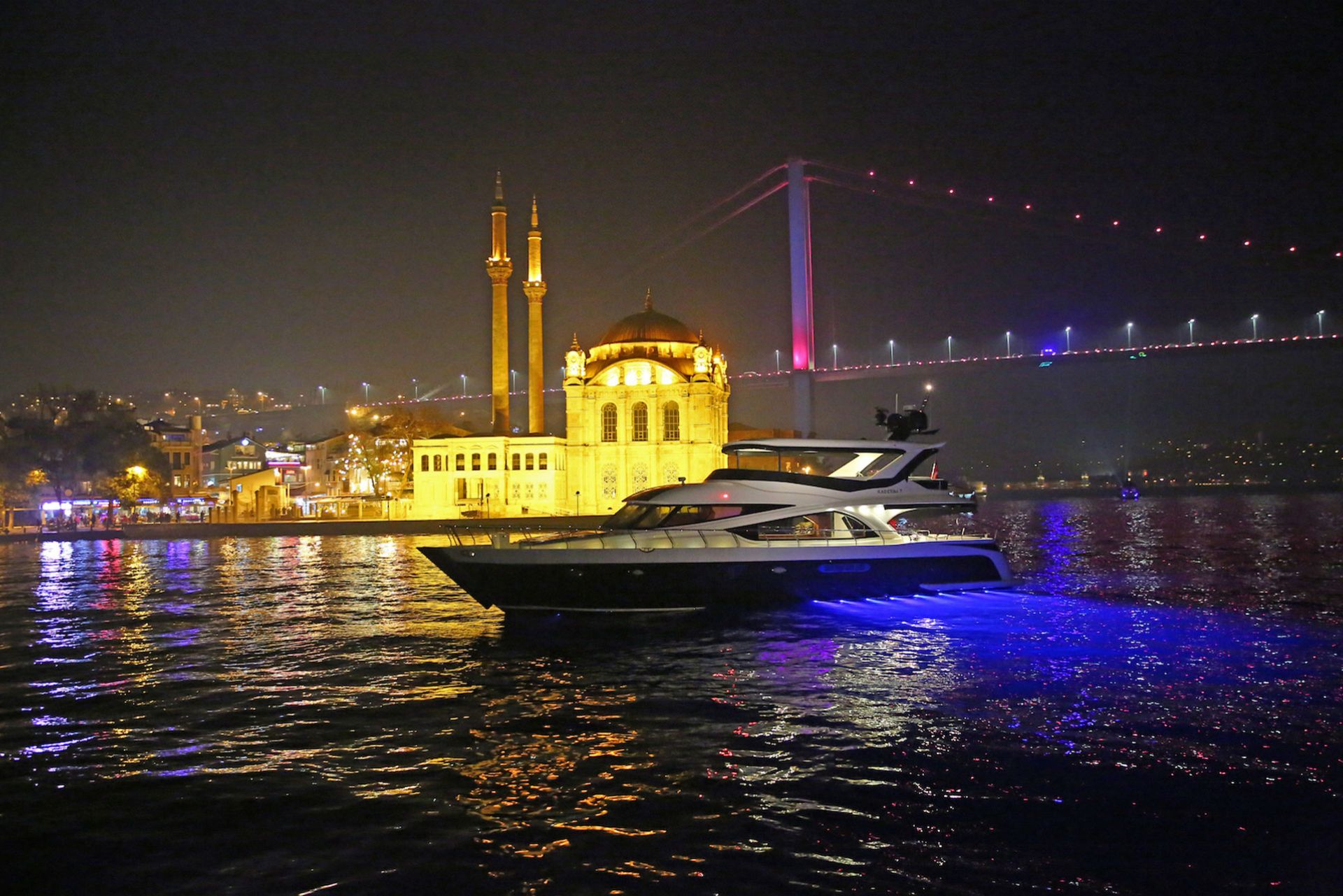 Bosphorus night cruise with illuminated palaces and bridges