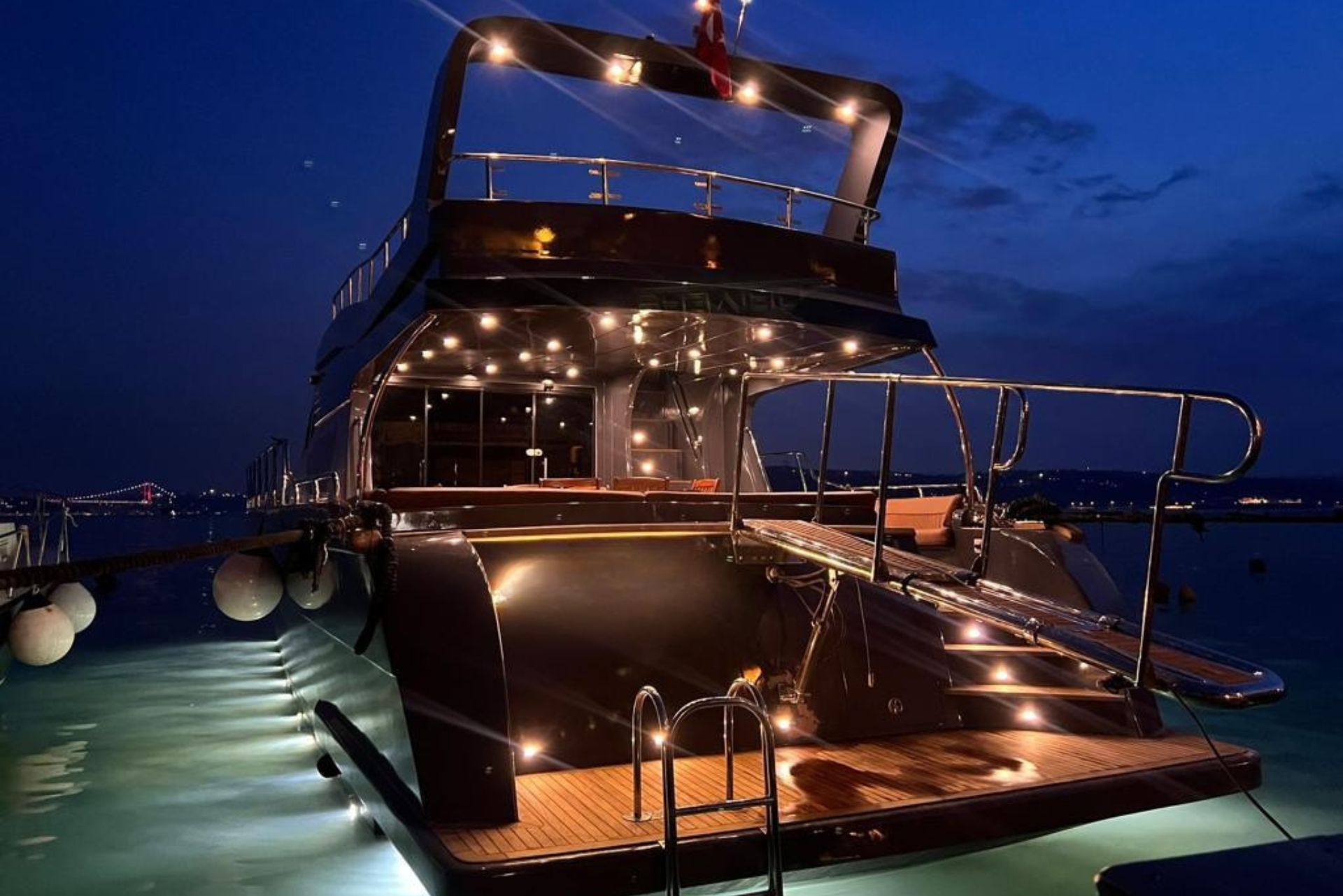 Luxury private dinner cruise on the Bosphorus with fine dining setup and illuminated night views of Istanbul.