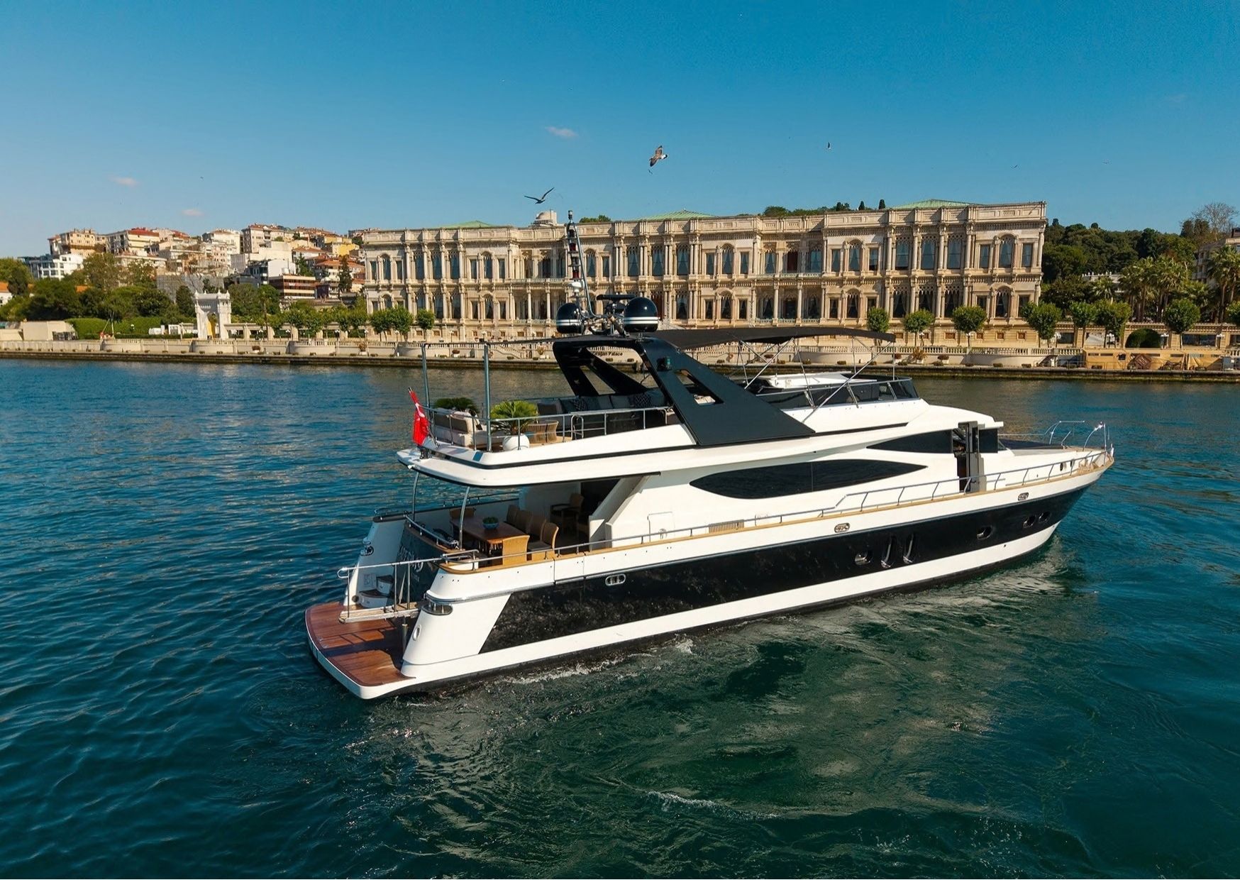 LUX KDR9 super yacht cruising past Dolmabahce Palace